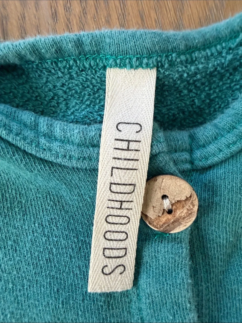Childhoods teal Button-Front Baby One-Piece